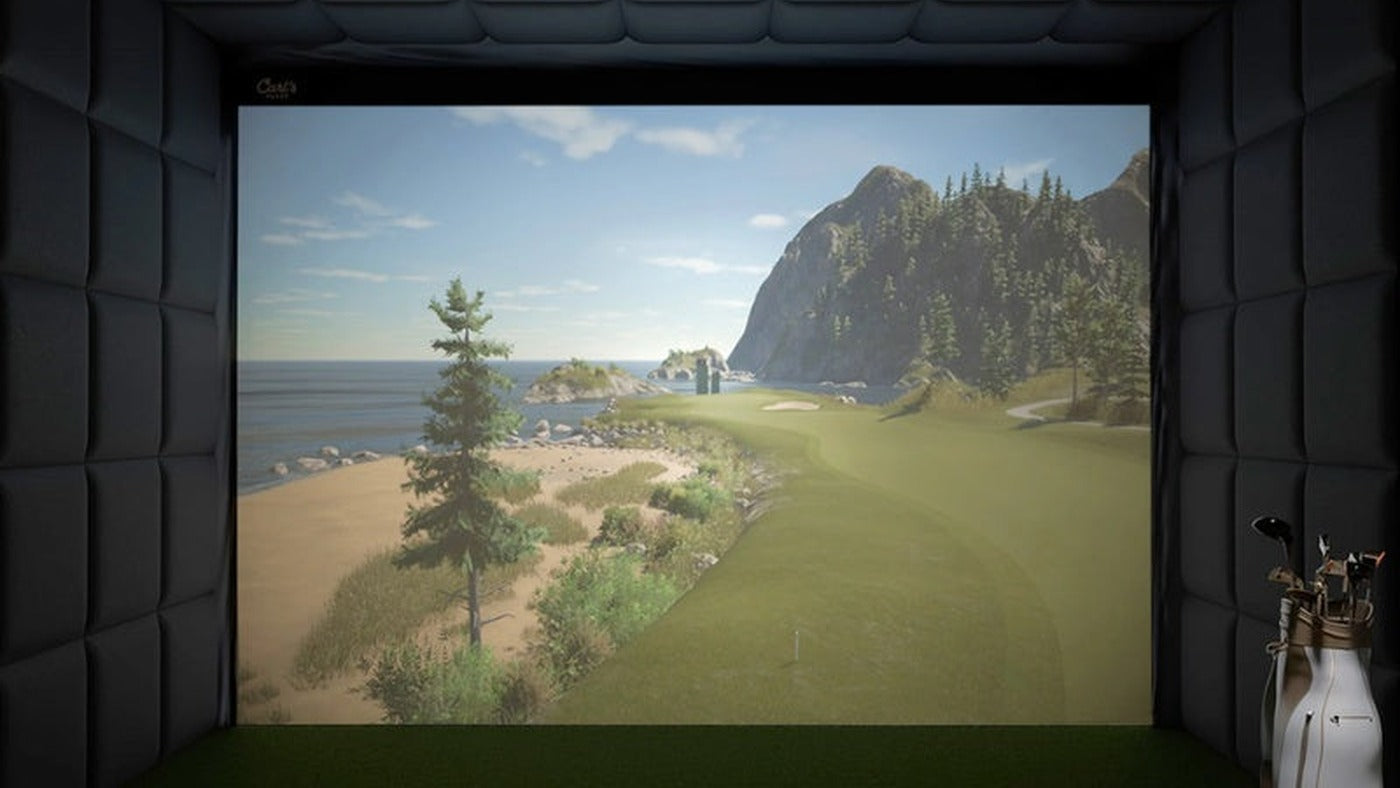 Enclosed indoor golf bay with padded walls, ceiling panels and a projected golf course.