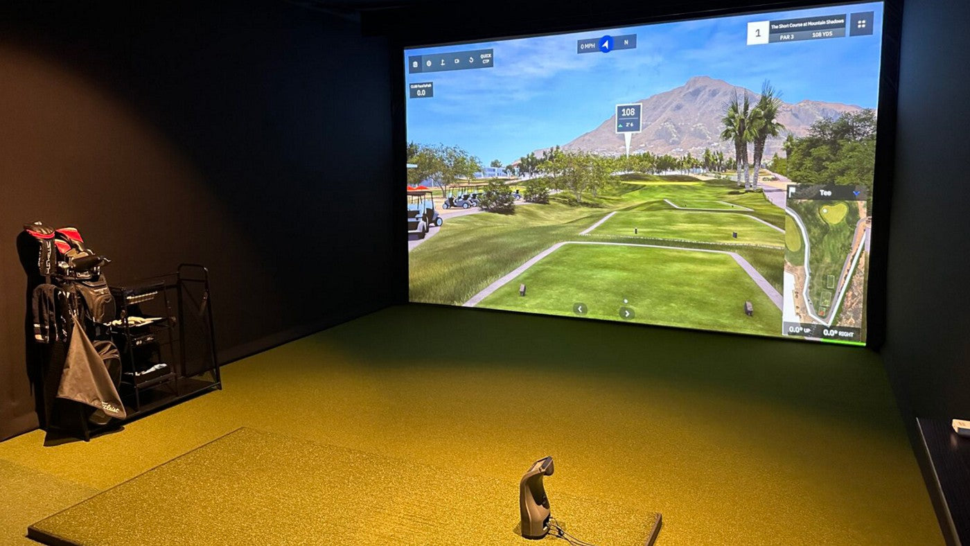 BenQ LK936ST golf simulator installation with a large course image and indoor hitting area
