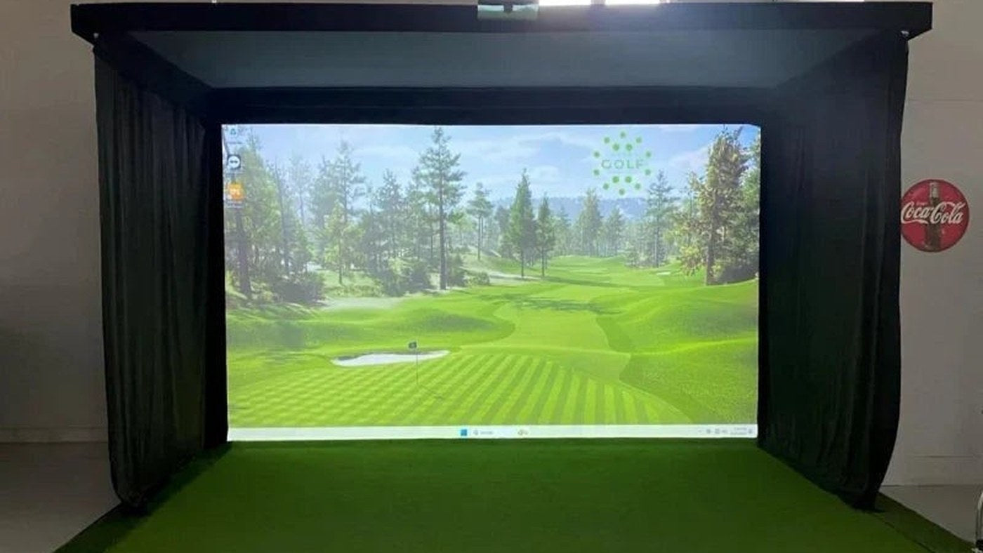 Side curtains framing an indoor golf simulator screen