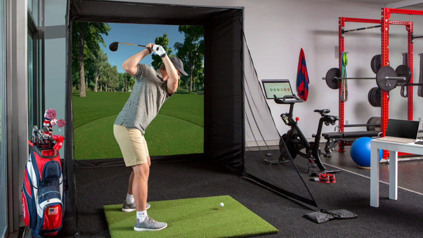 Home golf simulator installation shown in Carl's Place's room-planning photography.