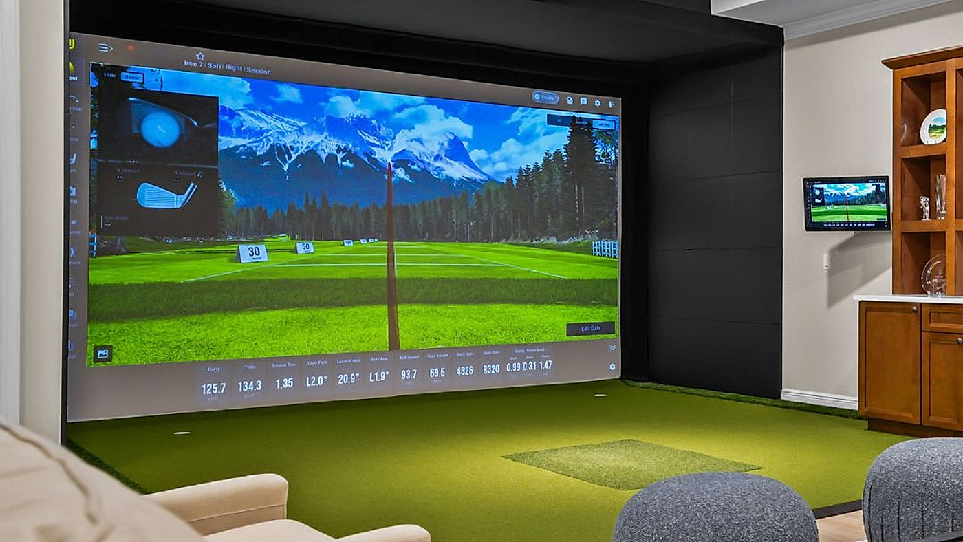 Uneekor EYE XO2 in a finished indoor golf simulator for the EYE XO versus EYE XO2 comparison.