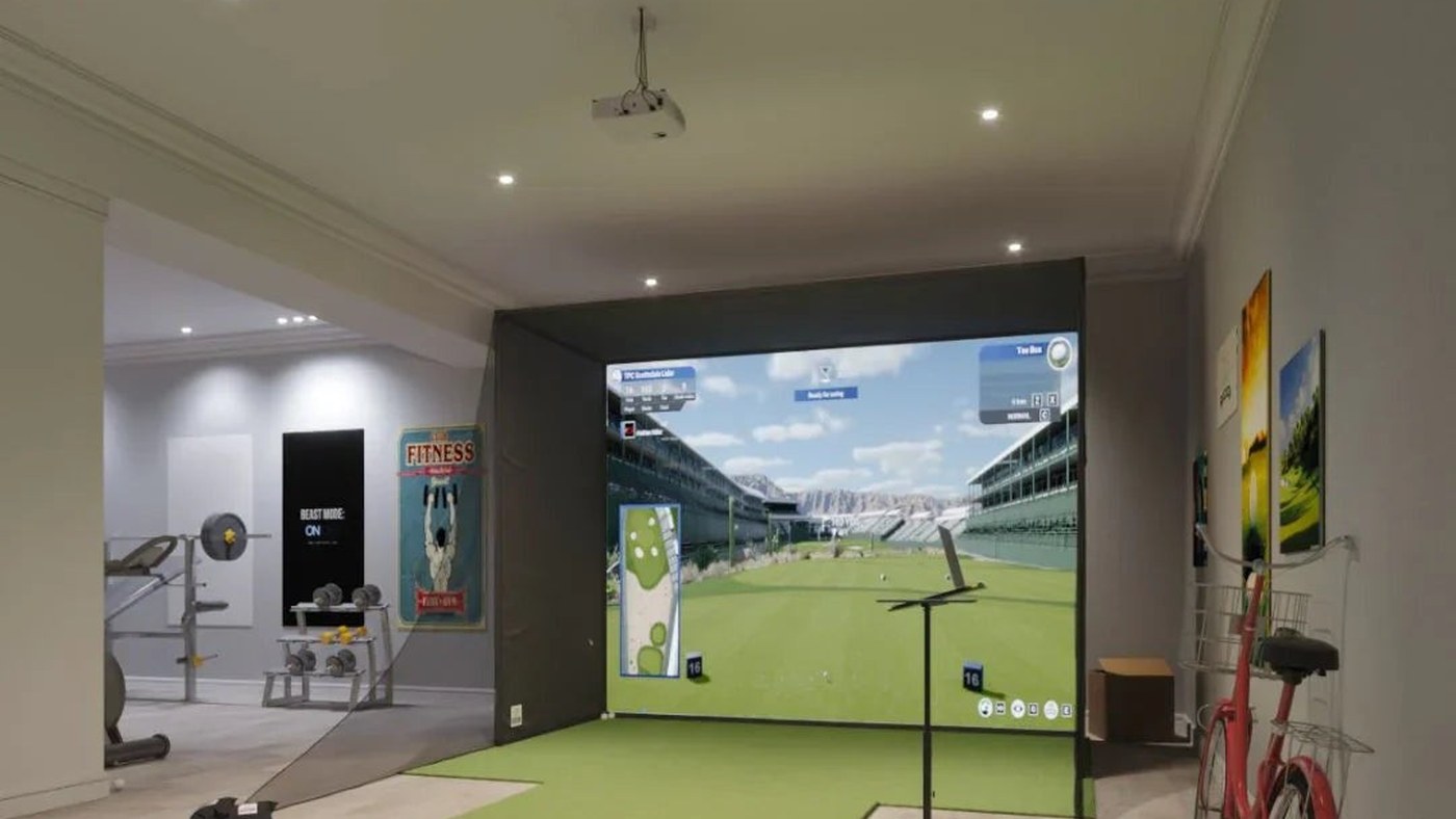 Home golf simulator room shown with the Uneekor EYE XR product