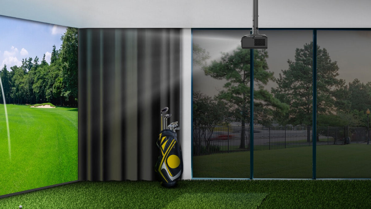 Ceiling-mounted BenQ projector above an indoor golf simulator hitting area