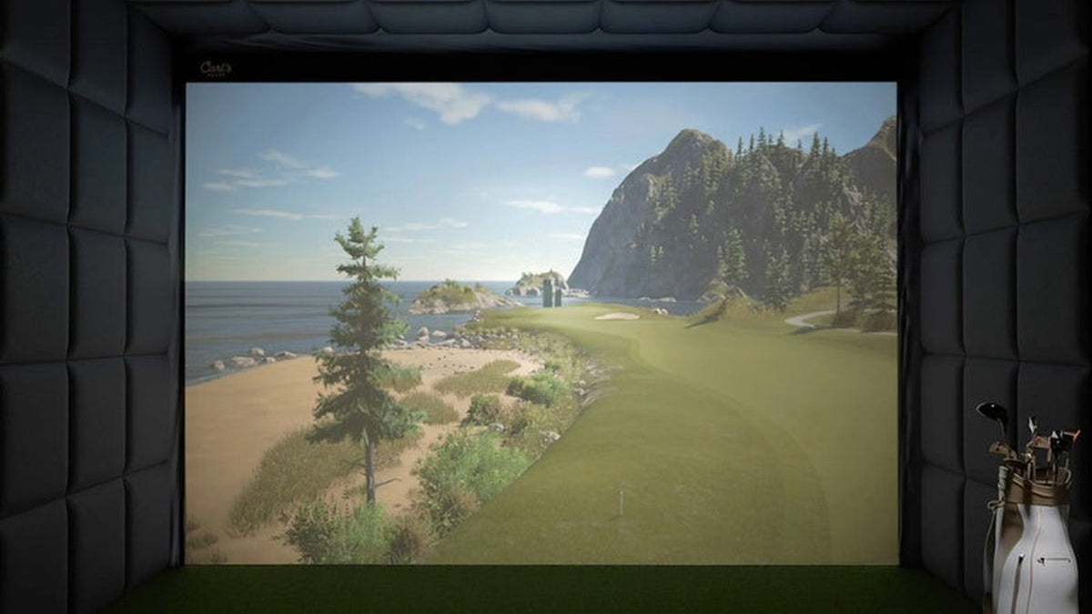 Enclosed indoor golf bay with padded walls, ceiling panels and a projected golf course.