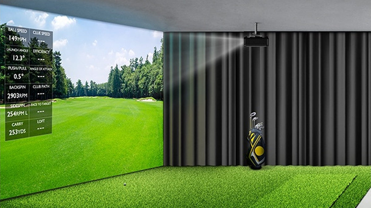 Projected golf course beside dark curtains in a home simulator room.