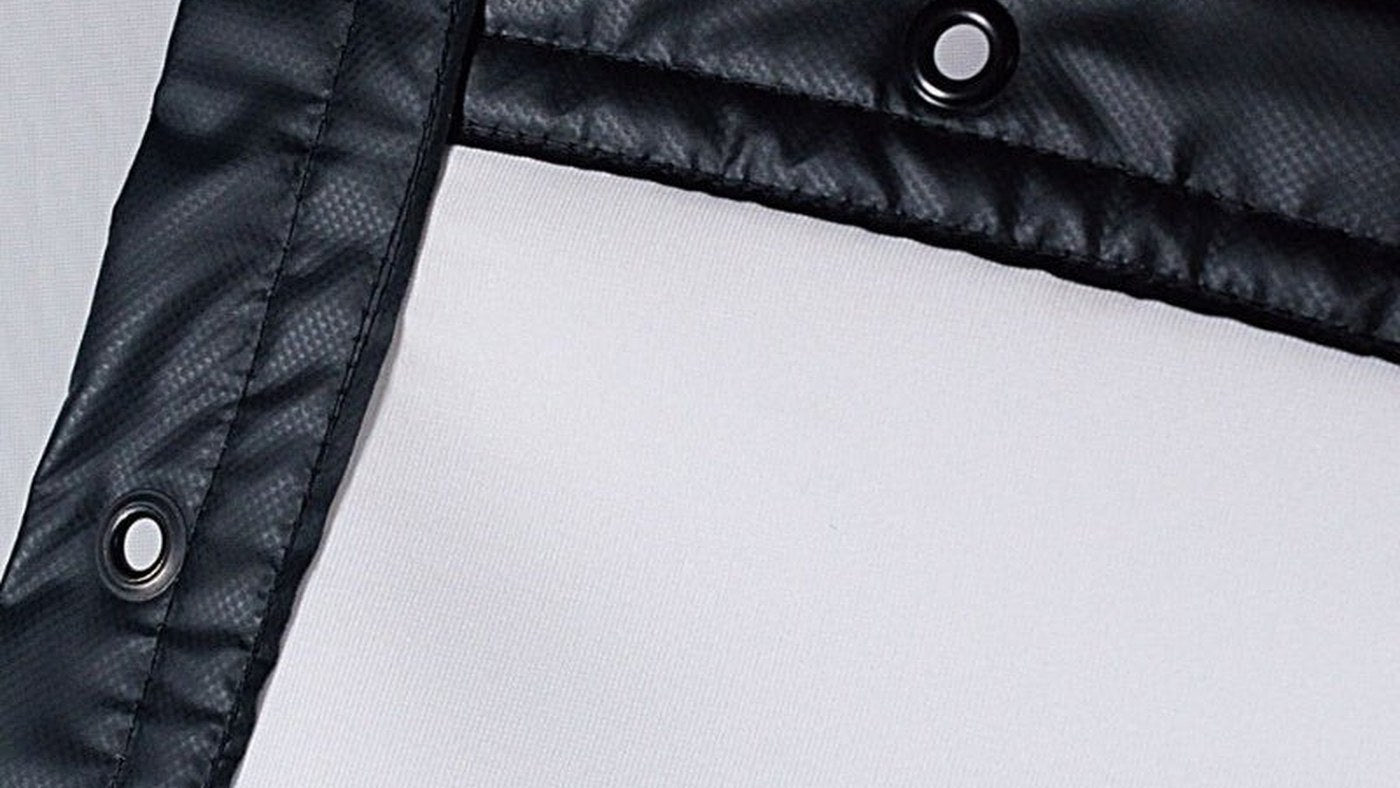 Close view of the reinforced edge and grommets on a SIGPRO impact screen