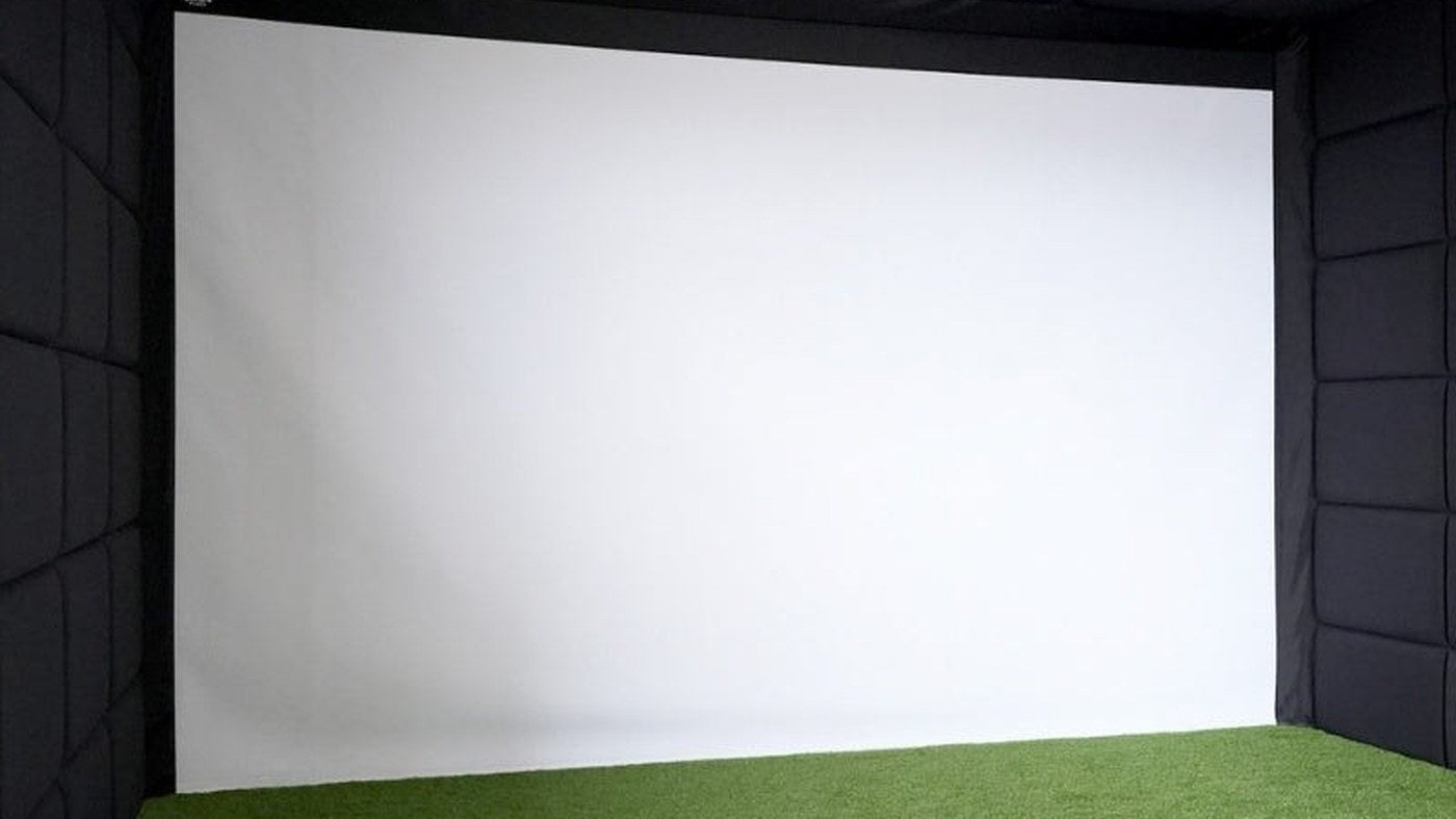 Indoor golf simulator room showing the screen and hitting area for room-planning context