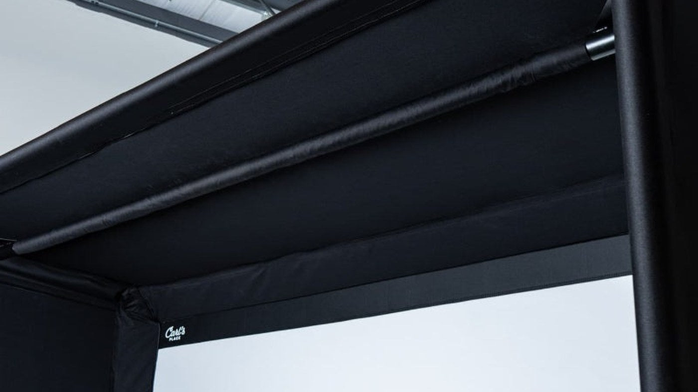 Upper frame and ceiling crossbar of a Carl's Place golf simulator enclosure.