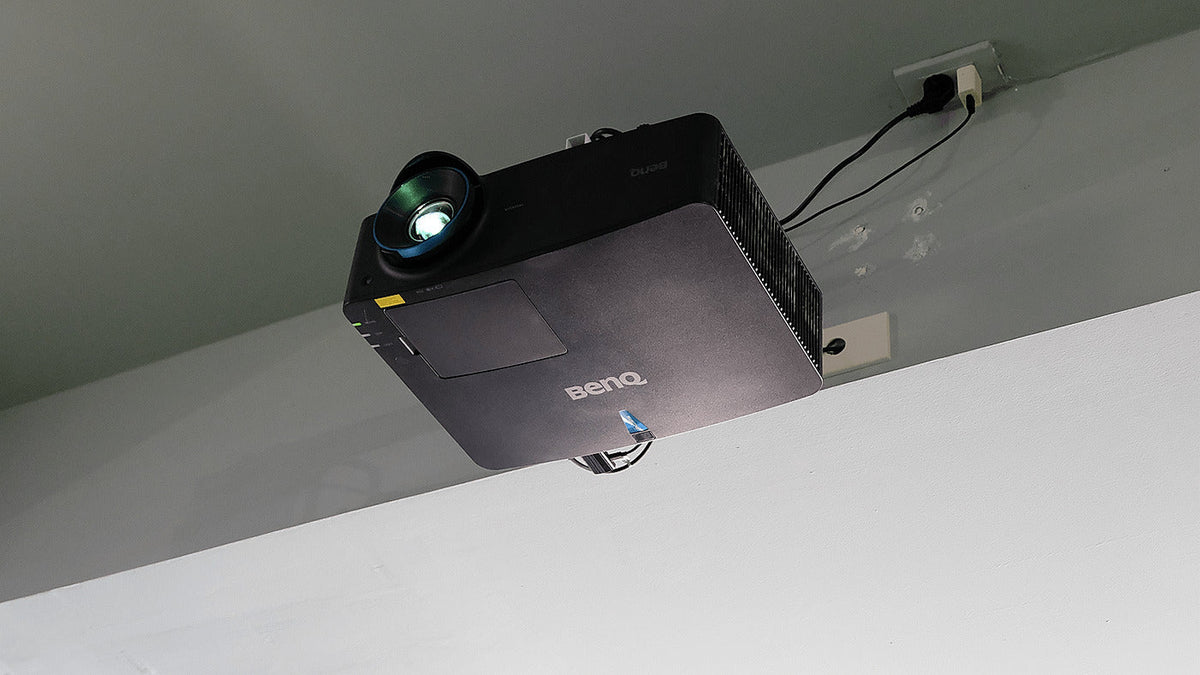 BenQ LU935ST installed in a golf simulator for the LU935ST versus LK936ST comparison.