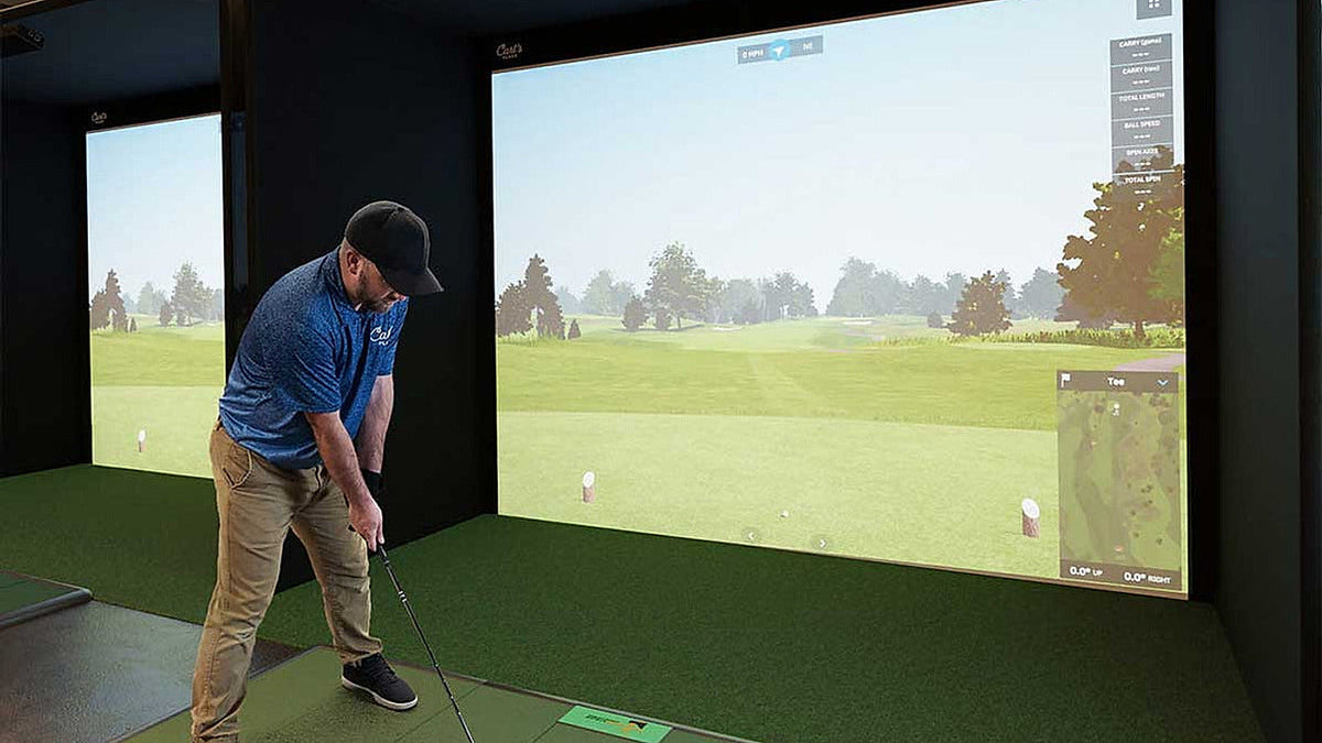 Carl's Place golf simulator enclosure installed in a finished room for the C-Series DIY versus Pro comparison.