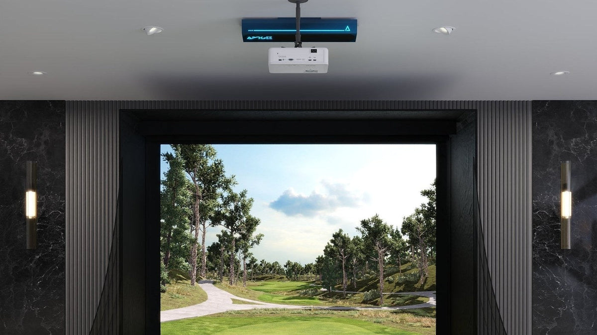 TruGolf APOGEE mounted above a simulator screen and hitting area